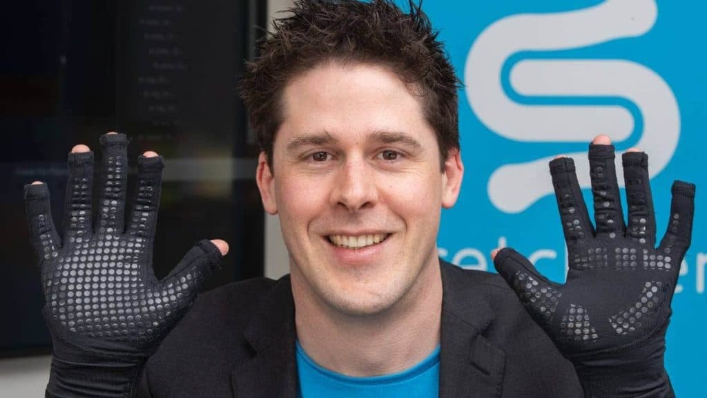 StretchSense CEO Ben O'Brien shows off the MoCap Pro gloves.